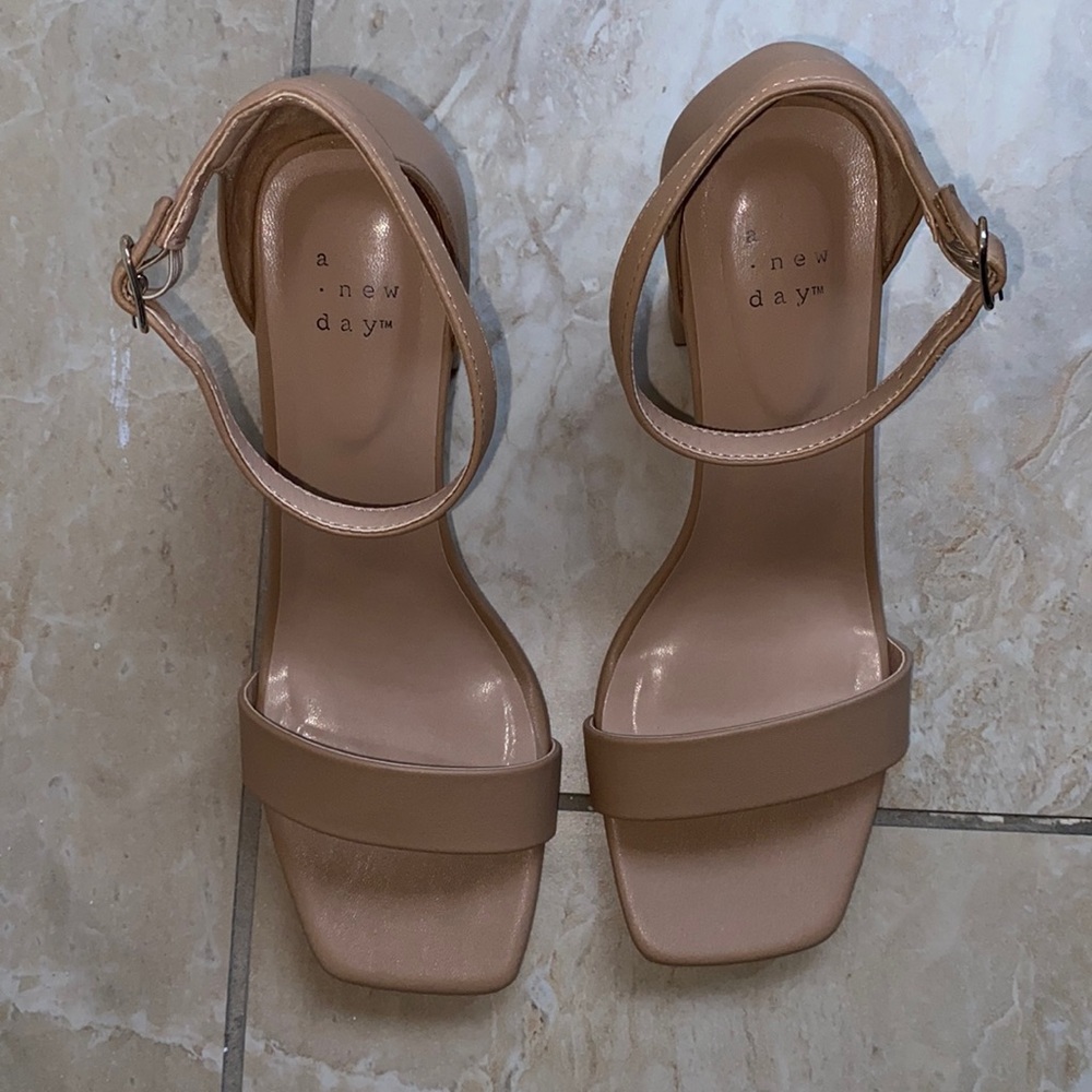 Nude cream open toe heals with strap.